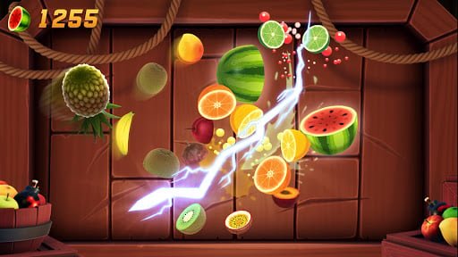 Fruit Ninja arcade mode in full swing with multiple fruits flying across the screen and score multipliers active