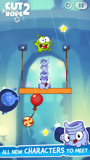 Om Nom happily eating candy after a successful three-star level completion with confetti effects